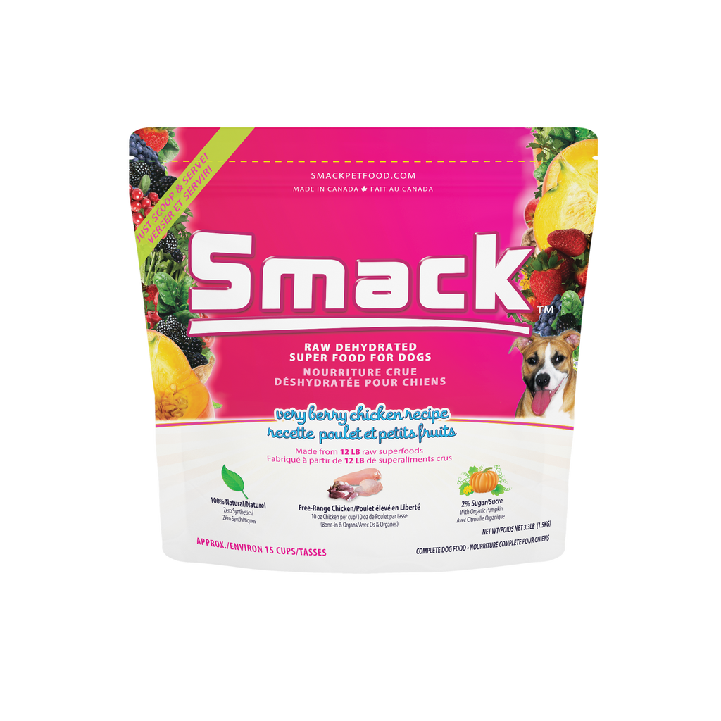 Smack dog food package with pink label and fruit illustrations on a white background